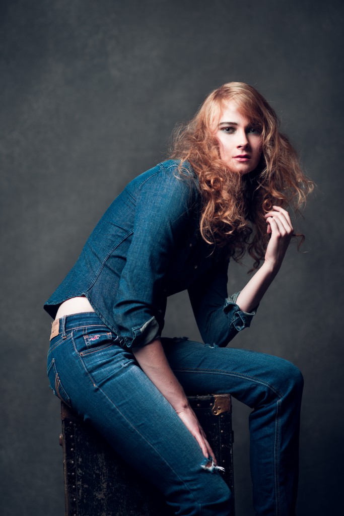 Dave Neighleigh backdrop behind Heidi in an all Jeans outfit Hudson Valley Headshot Photogapher