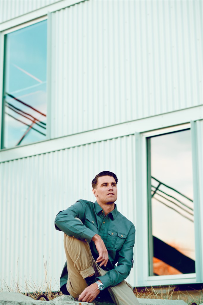 Peter sitting on a ledge, modeling shot for wilhelmina Hudson Valley